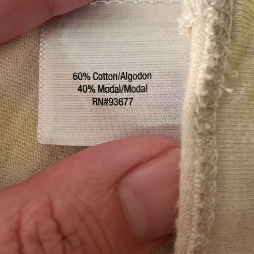 Cream shirt with blues and greens that resemble leaves on a cap sleeve shirt - Picture 8 of 8